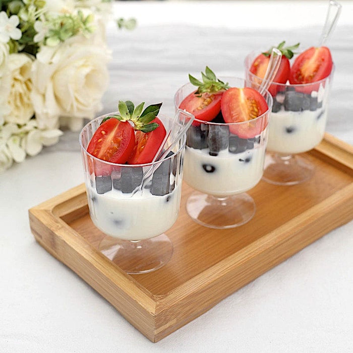 https://leilaniwholesale.com/cdn/shop/files/24-clear-5-oz-ribbed-round-plastic-dessert-cups-with-spoons-set-disposable-tableware-dsp-dst-cu003-5-clr-30789521473599_700x700.jpg?v=1685003632