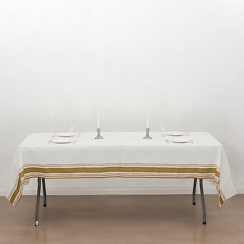 50" x 108" Airlaid Paper Rectangular Tablecloth with Gold Striped Border - White TAB_DSP_002_50108_WHGD
