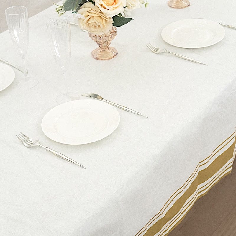50" x 108" Airlaid Paper Rectangular Tablecloth with Gold Striped Border - White TAB_DSP_002_50108_WHGD