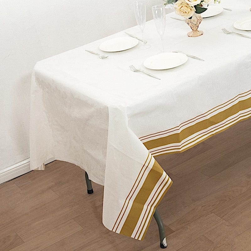 50" x 108" Airlaid Paper Rectangular Tablecloth with Gold Striped Border - White TAB_DSP_002_50108_WHGD