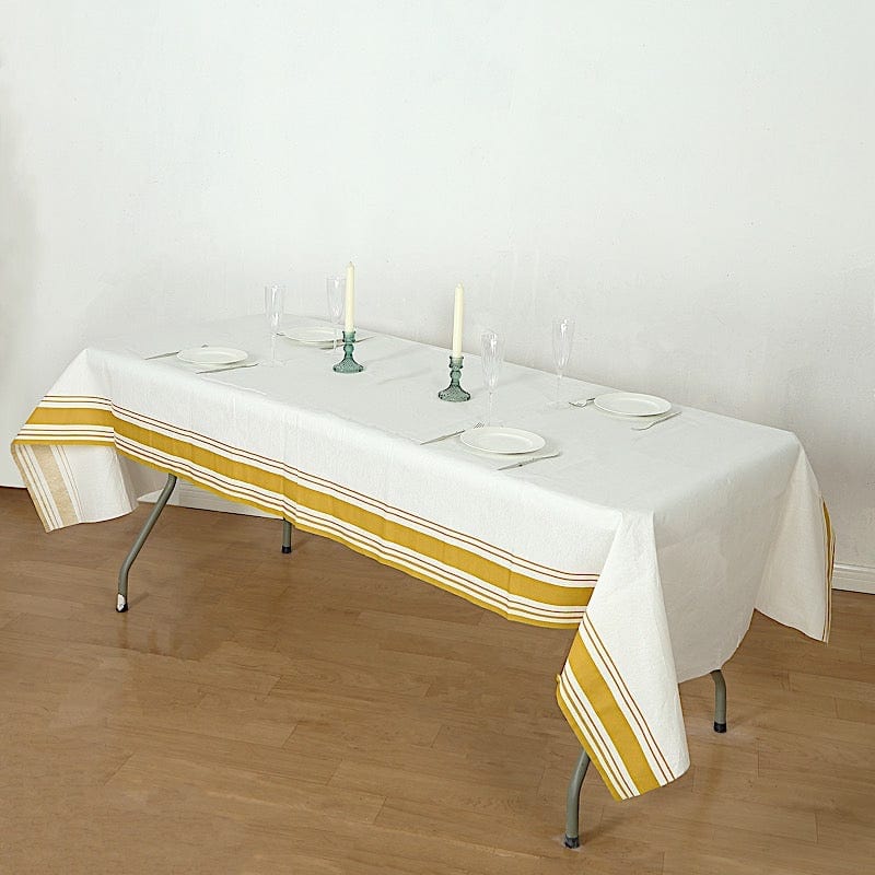 50" x 108" Airlaid Paper Rectangular Tablecloth with Gold Striped Border - White TAB_DSP_002_50108_WHGD