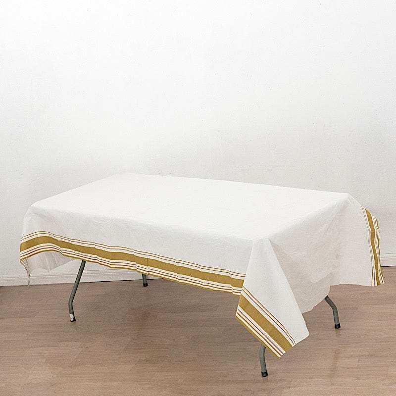 50" x 108" Airlaid Paper Rectangular Tablecloth with Gold Striped Border - White TAB_DSP_002_50108_WHGD