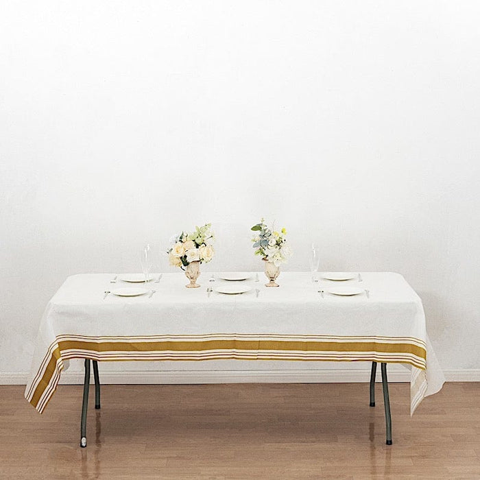 50" x 108" Airlaid Paper Rectangular Tablecloth with Gold Striped Border - White TAB_DSP_002_50108_WHGD