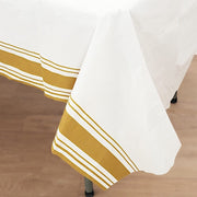 50" x 108" Airlaid Paper Rectangular Tablecloth with Gold Striped Border - White TAB_DSP_002_50108_WHGD