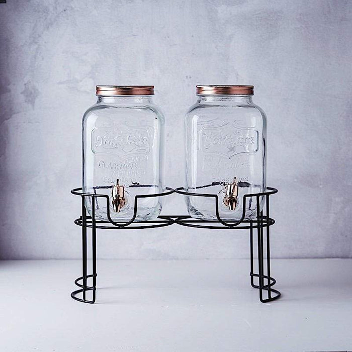 https://leilaniwholesale.com/cdn/shop/products/2-pcs-2-gallons-jar-glass-beverage-dispensers-set-with-spigot-and-stand-clear-and-gold-disp-glas01-1-clr-15814339952703_700x700.jpg?v=1629344598