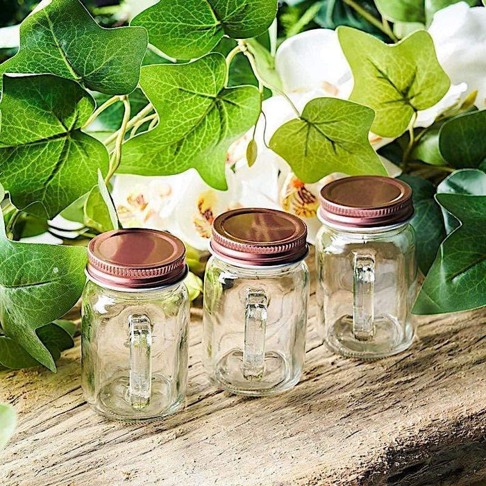 https://leilaniwholesale.com/cdn/shop/products/4-pcs-4-oz-glass-mason-mini-jars-with-lids-clear-and-rose-gold-glas-jar03rg-clr-15864587386943_700x700.jpg?v=1629771559