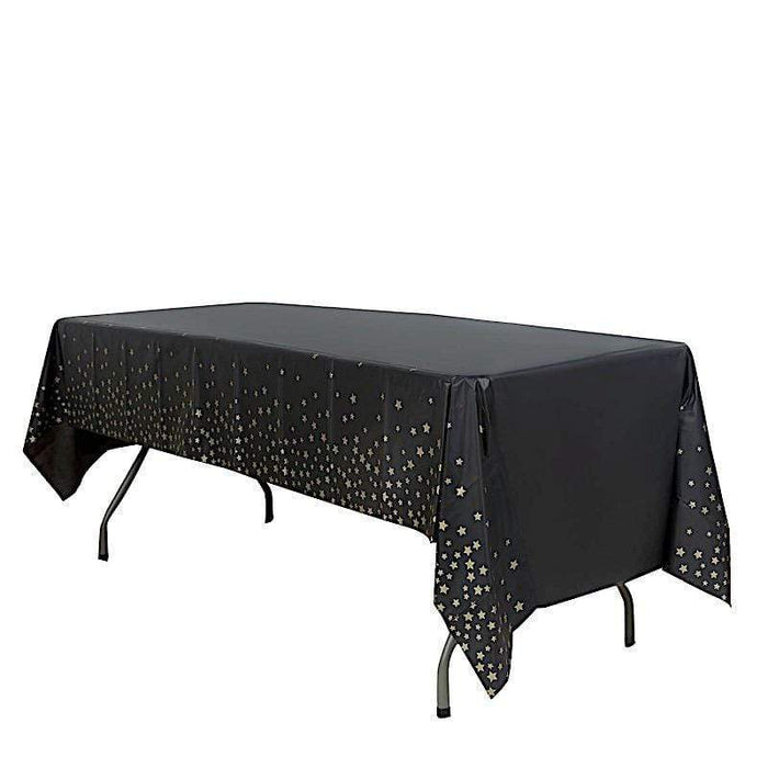 54" x 108" Rectangular Disposable Plastic Tablecloth with Star Sprinkled Design - Black and Gold TAB_PVC_STR01_108_BLKGD