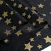 54" x 108" Rectangular Disposable Plastic Tablecloth with Star Sprinkled Design - Black and Gold TAB_PVC_STR01_108_BLKGD