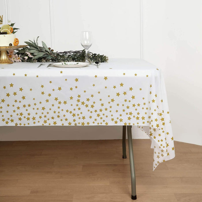54" x 108" Rectangular Disposable Plastic Tablecloth with Star Sprinkled Design - White and Gold TAB_PVC_STR01_108_WHTGD