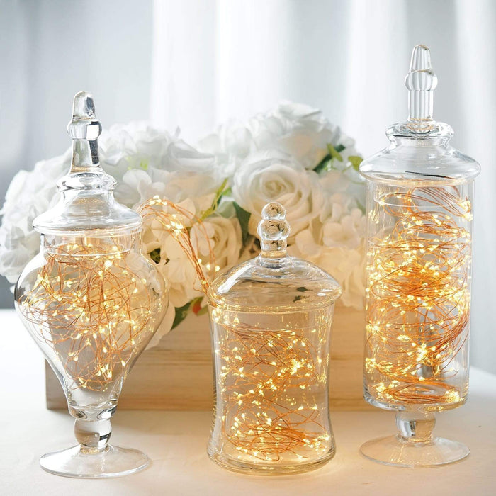 https://leilaniwholesale.com/cdn/shop/products/set-of-3-9-13-14-tall-glass-apothecary-jars-containers-with-lids-clear-glas-jar11-clr-4735789891647_700x700.jpg?v=1630188610