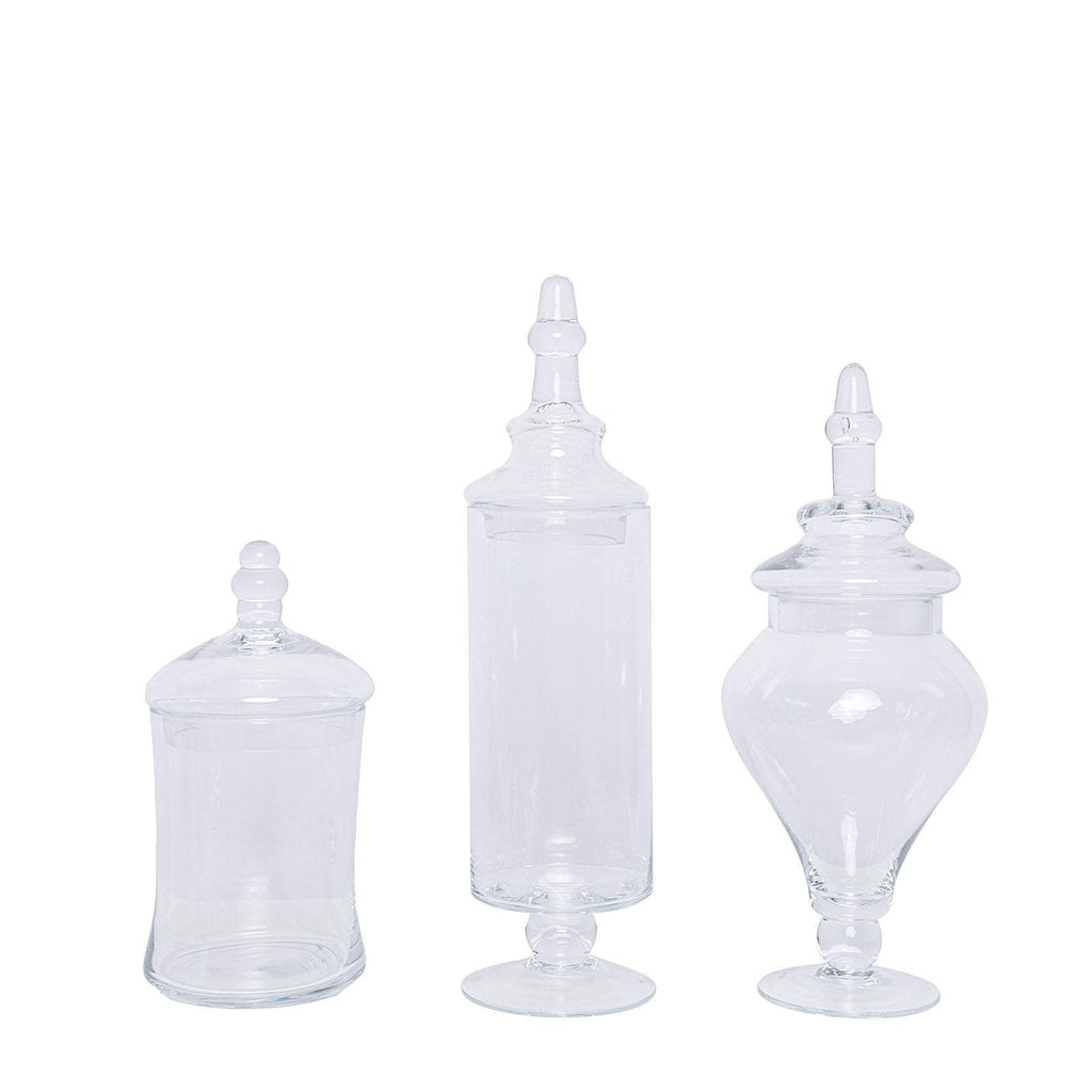 https://leilaniwholesale.com/cdn/shop/products/set-of-3-9-13-14-tall-glass-apothecary-jars-containers-with-lids-clear-glas-jar11-clr-4764413329471_1024x1024.jpg?v=1630188610